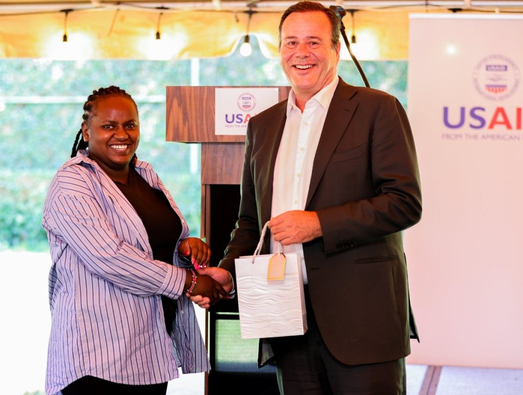 Sylvia receiving the On-the-Spot Award at USAID Kenya